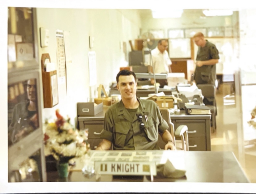 1st Lieutenant Bryan Knight working at his desk (1st Logistical Command)